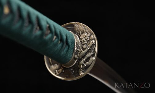 Onizumi Katana Tsuba aus weissem Kupfer mit detailliertem Dämonenmotiv